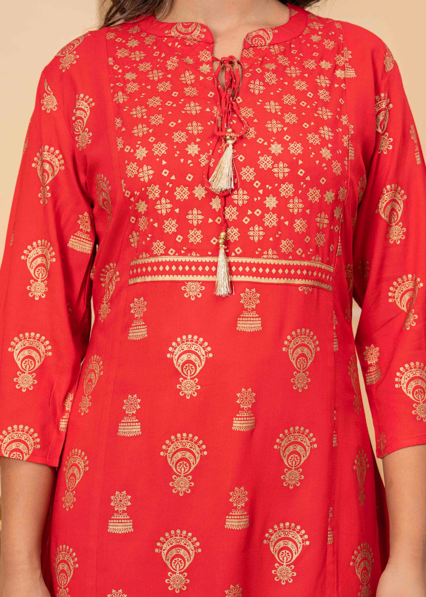 Red Printed Kurti with Beige Leggings