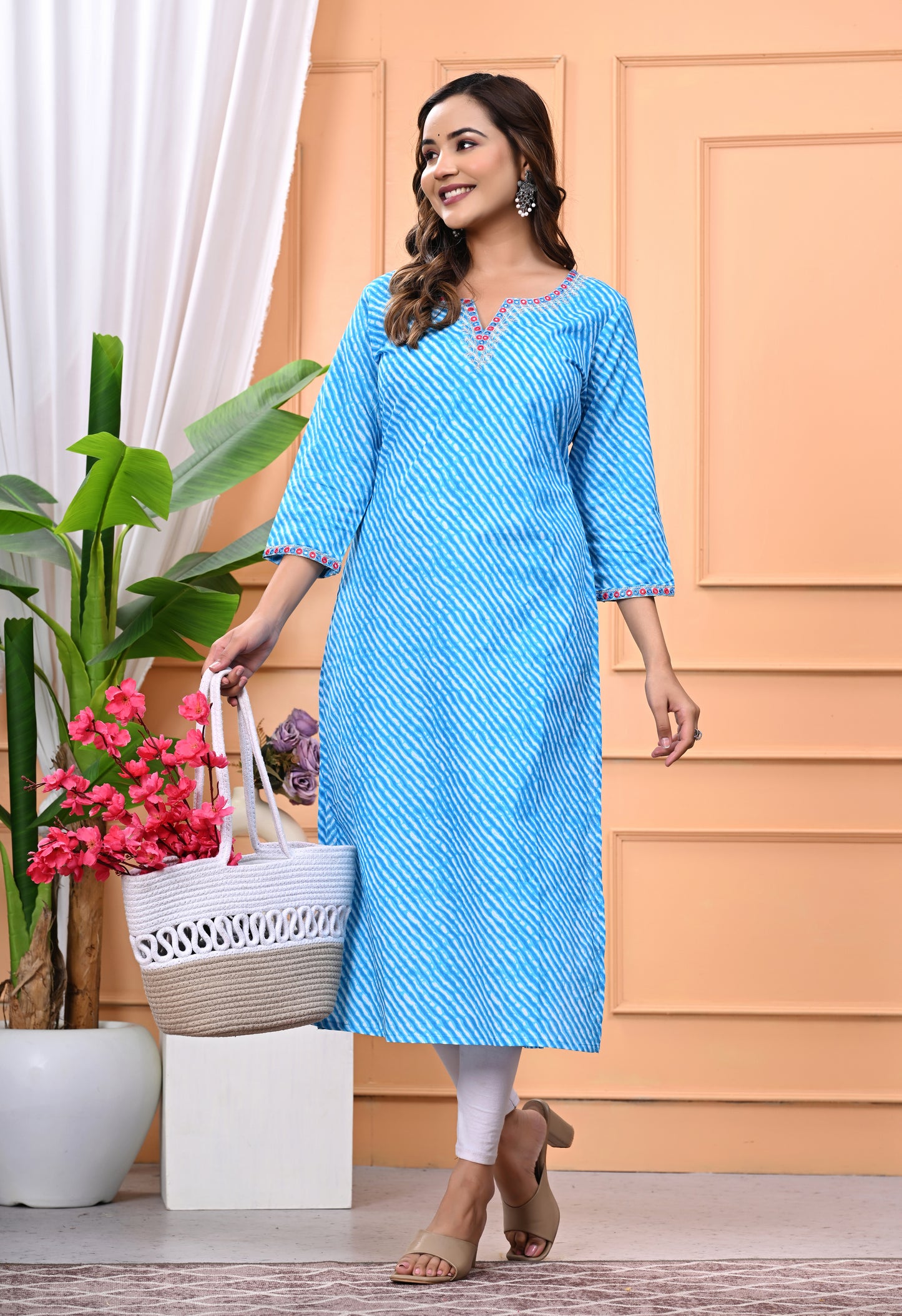 Women's Sky Blue Printed Cotton Kurti with Embroidered Neckline and 3/4 Sleeves"